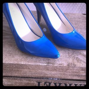 Bright blue pointed toe high heel shoes